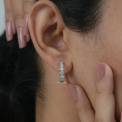 On-ear front view of round Diamond Huggie Earrings for women in USA, a classic jewelry choice.