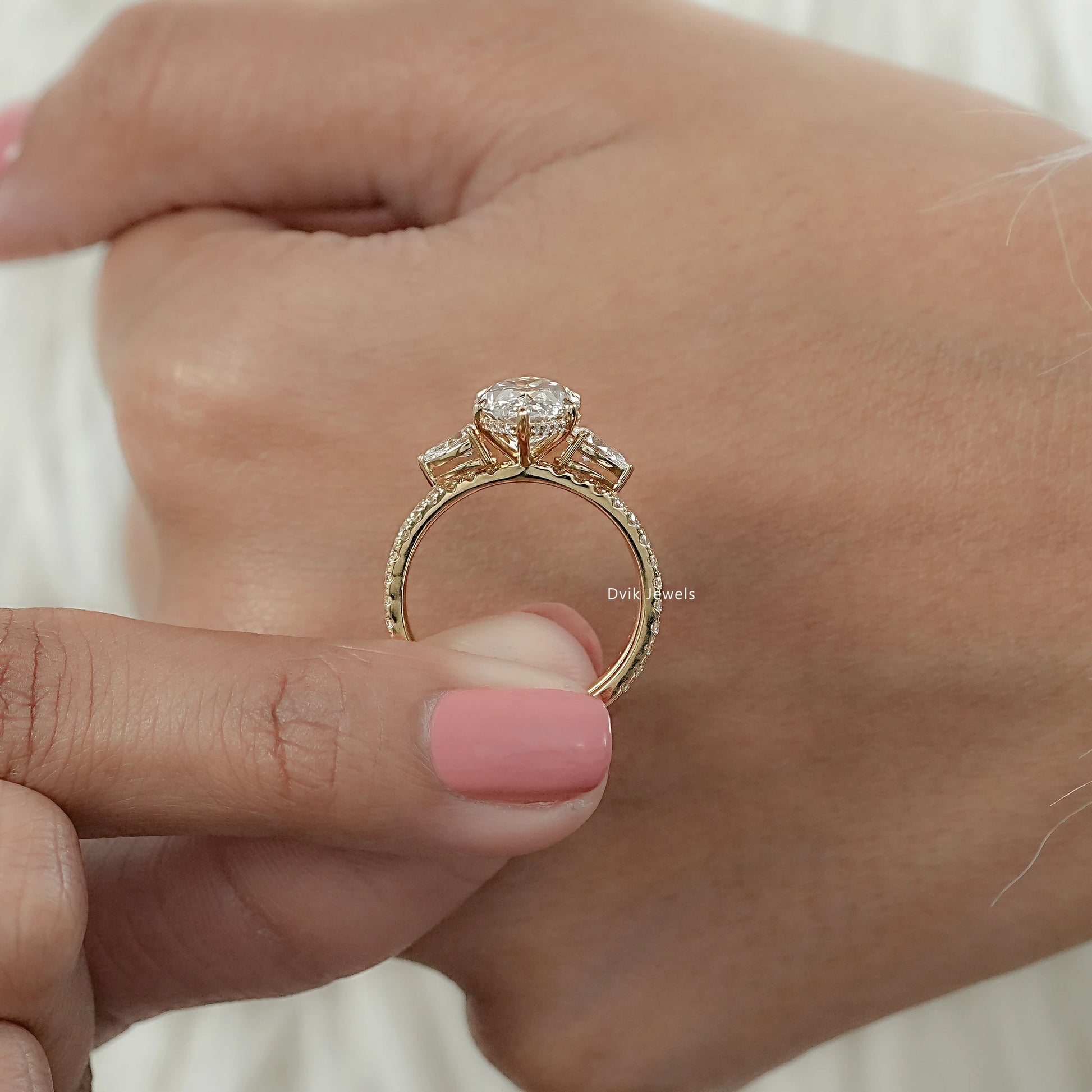 Detailed view of structural design and metal on white gold marquise cut double band bridal set