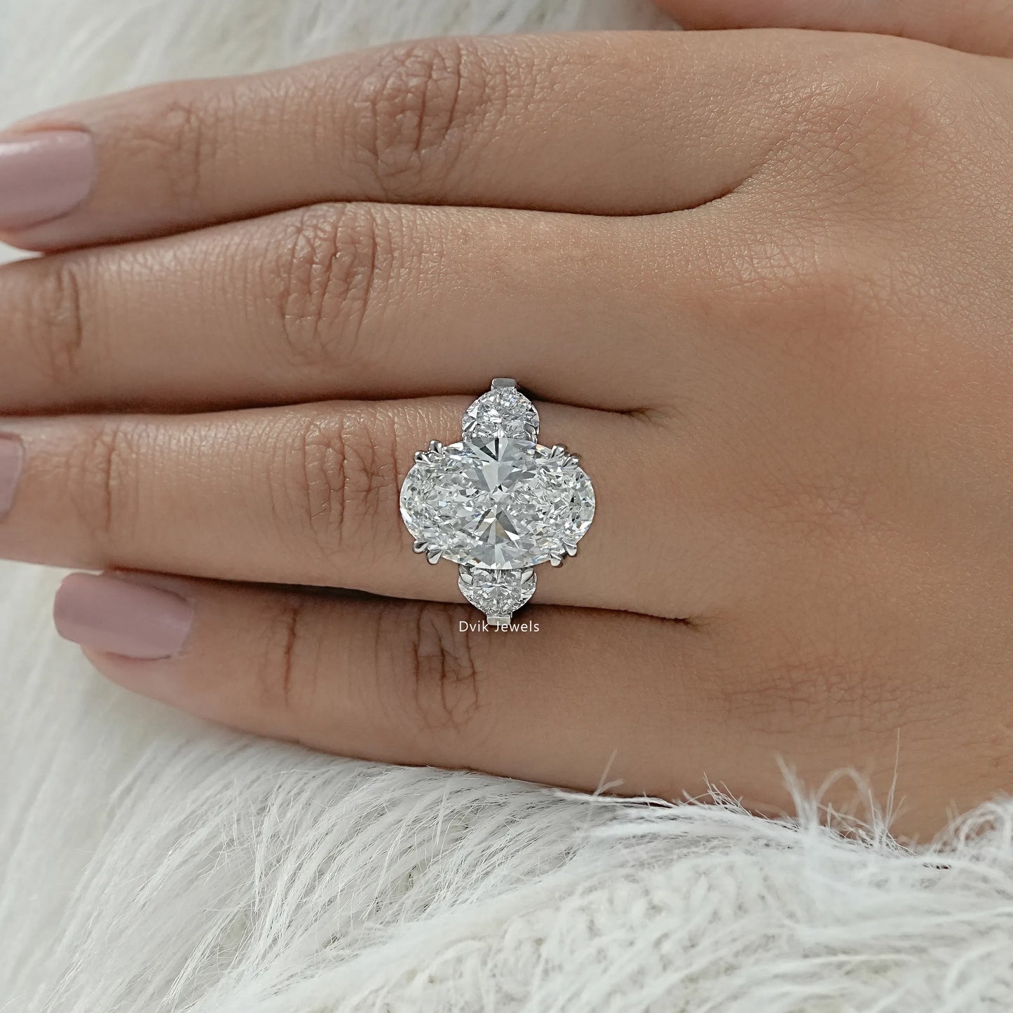 Oval diamond ring with heart side stones unique three stone ring top view