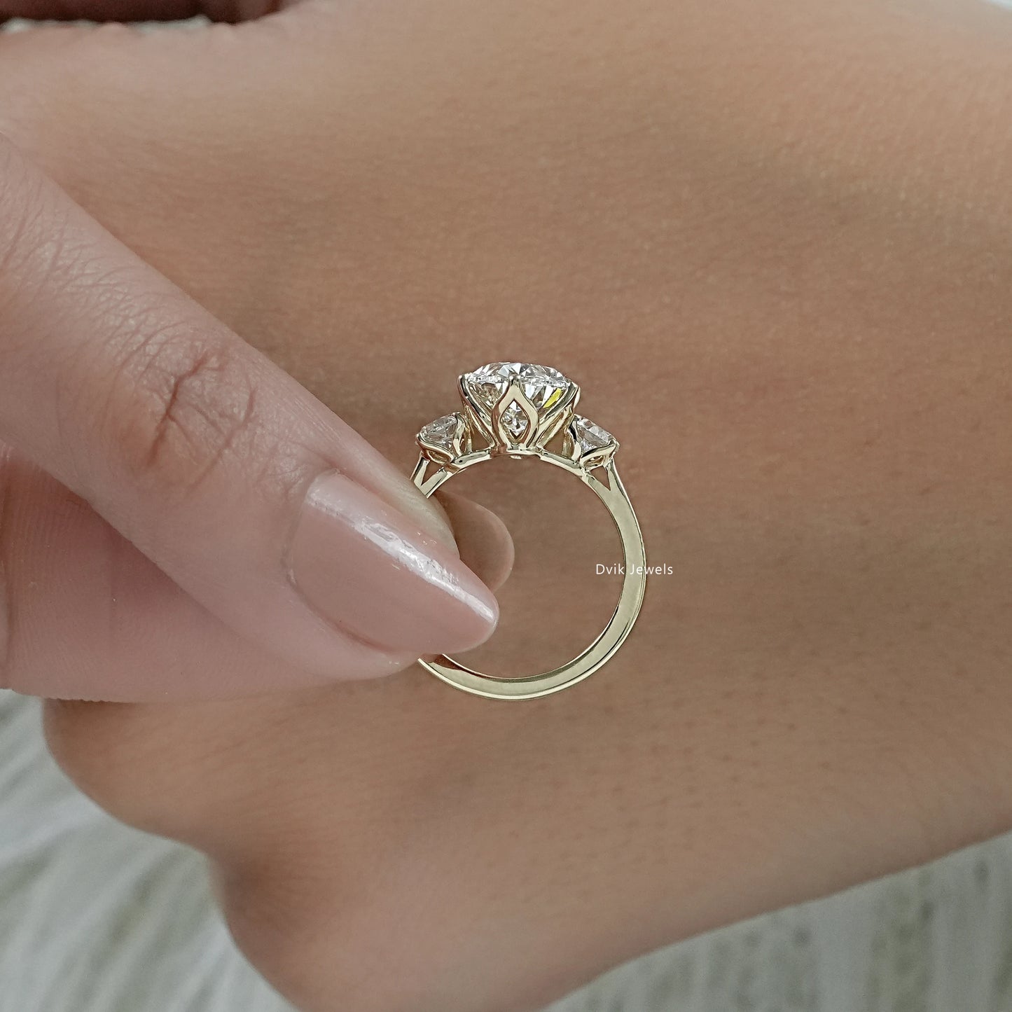 3 stone diamond anniversary ring featuring a classic three diamond design