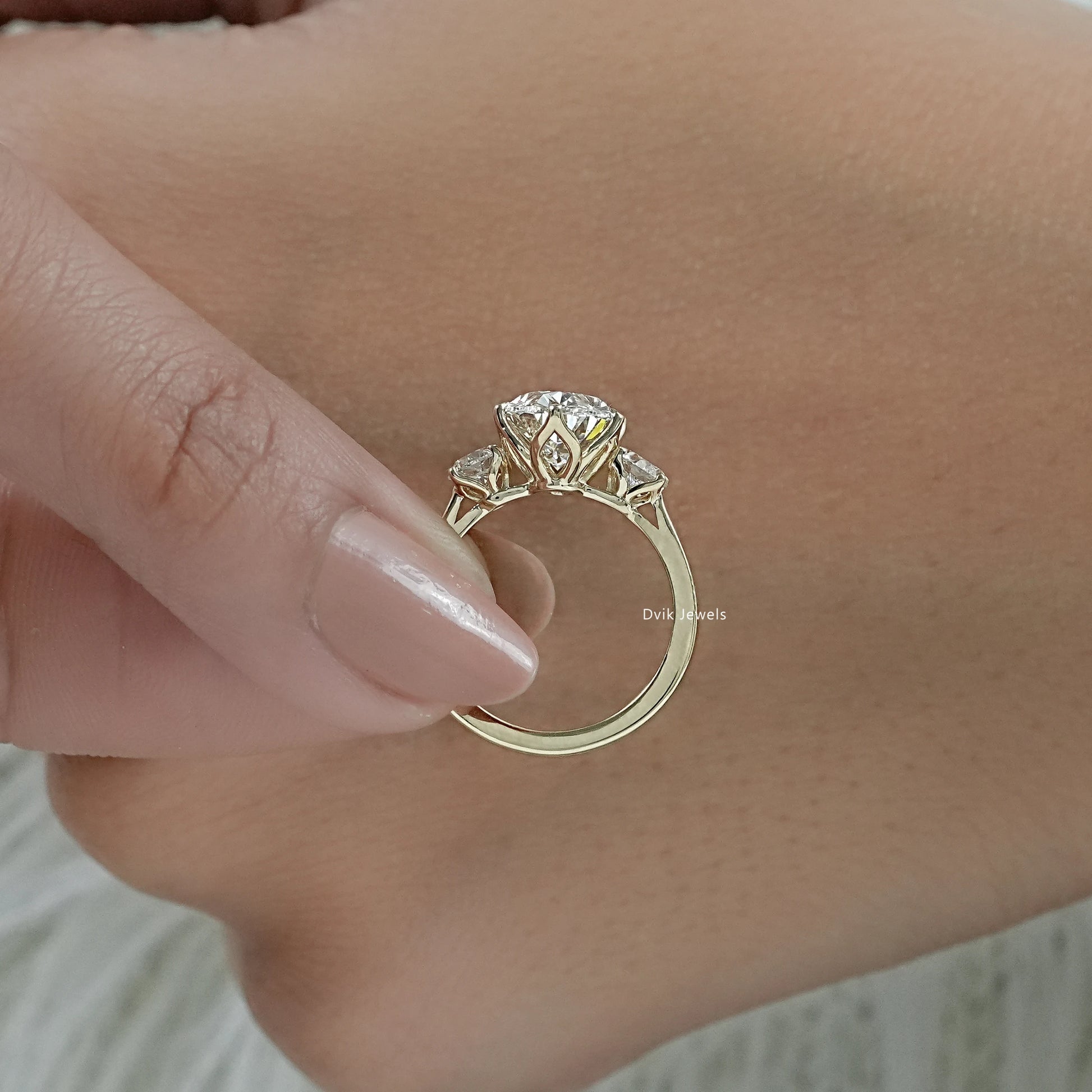 3 stone diamond anniversary ring featuring a classic three diamond design