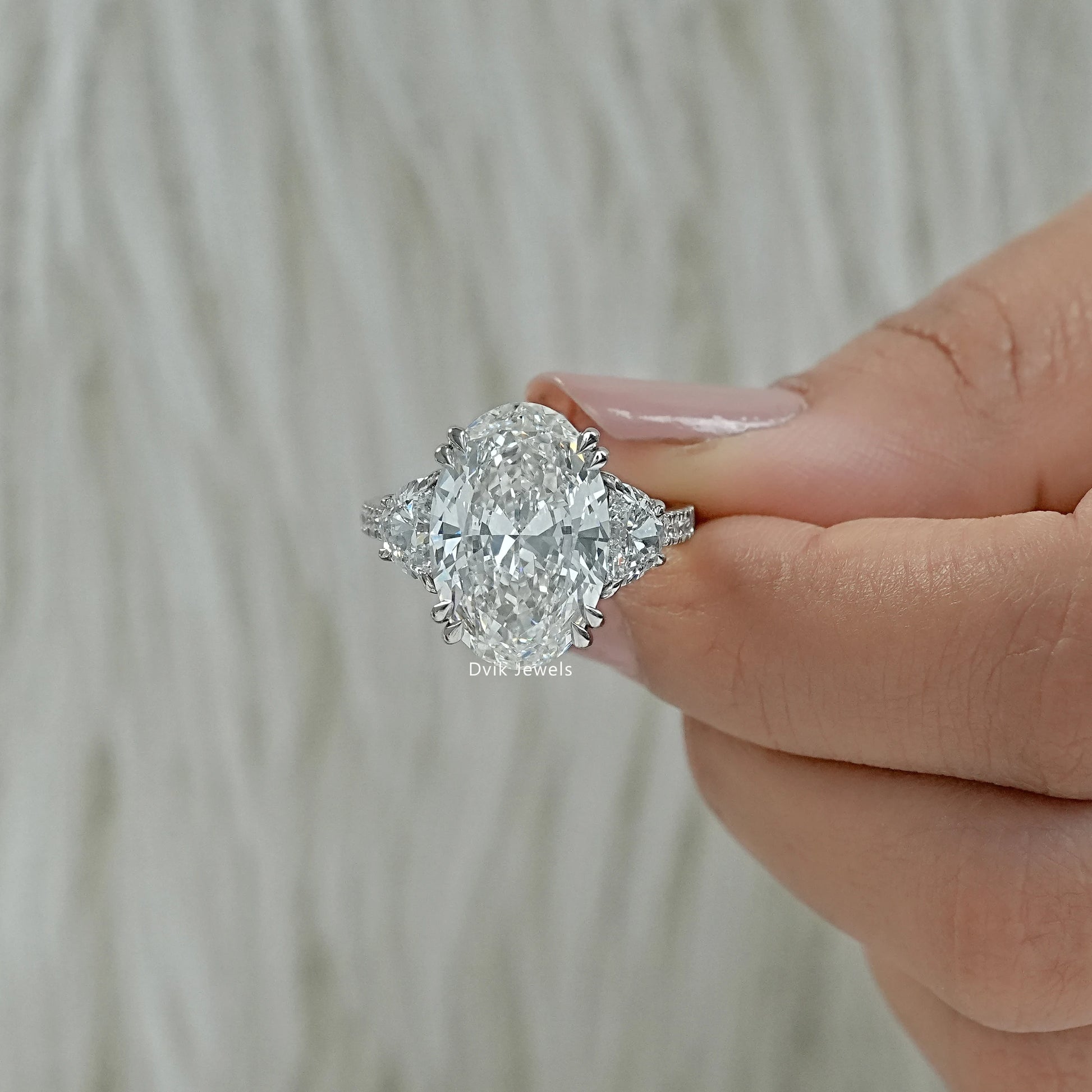 Three stone oval engagement ring white gold finger view