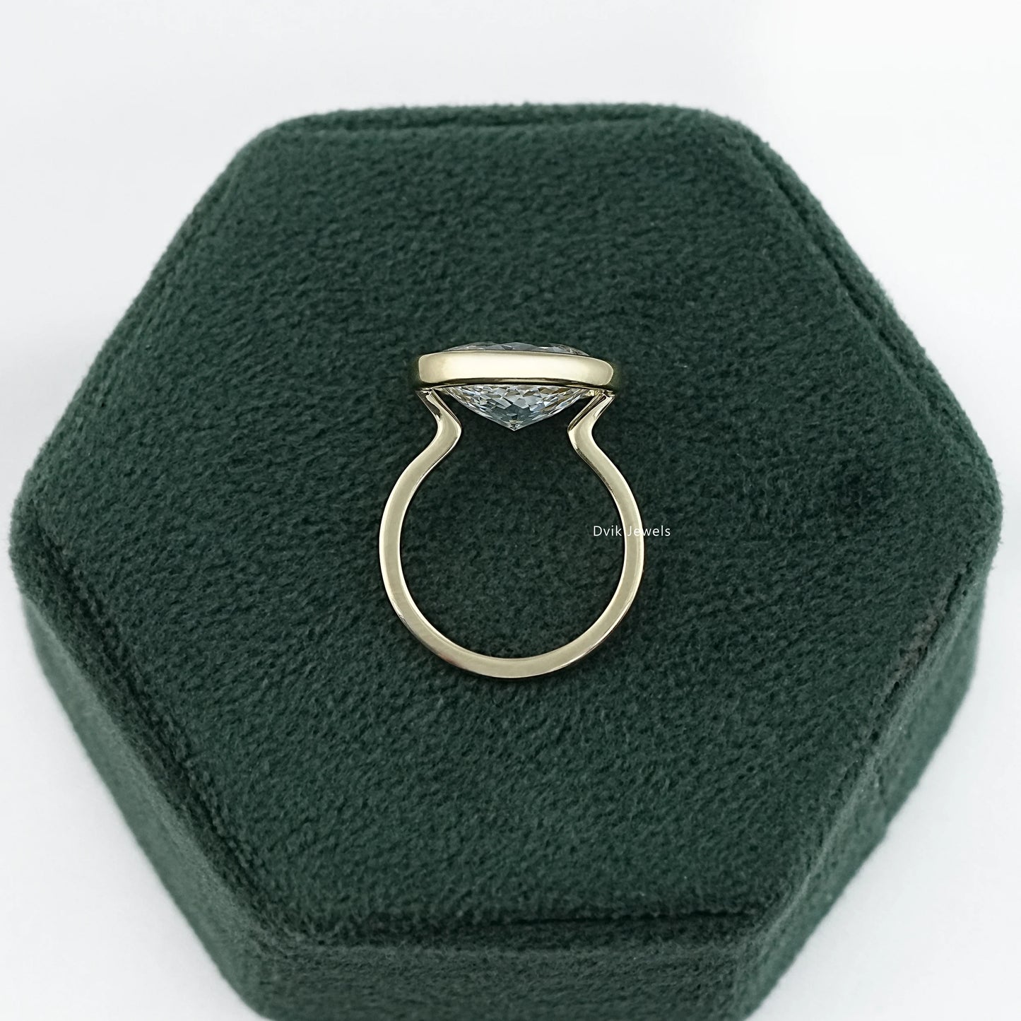 Bezel set solitaire ring yellow gold oval lab diamond side profile