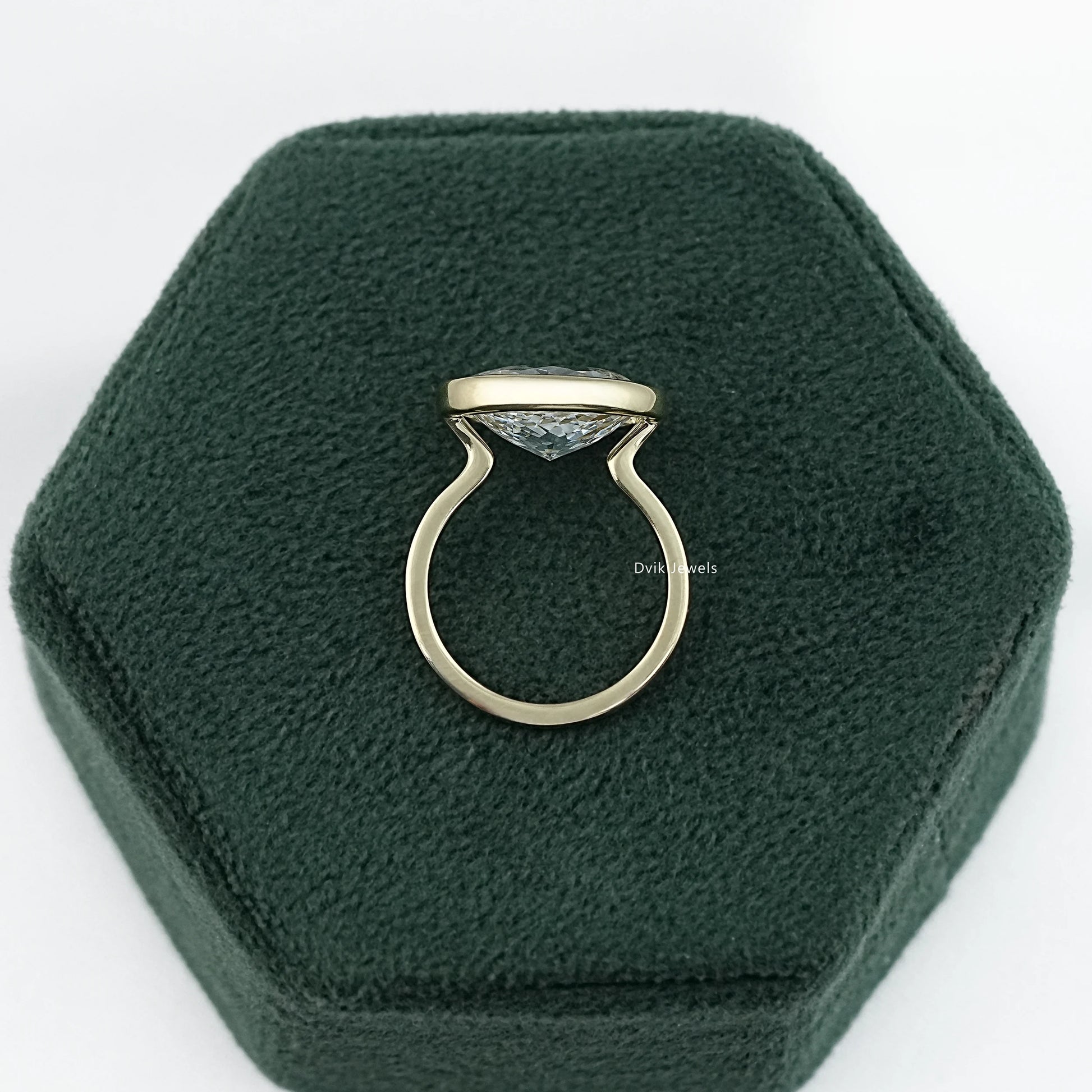 Bezel set solitaire ring yellow gold oval lab diamond side profile