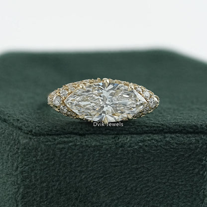 Dvik Jewels show marquise cut lab diamond pave set engagement ring on green box