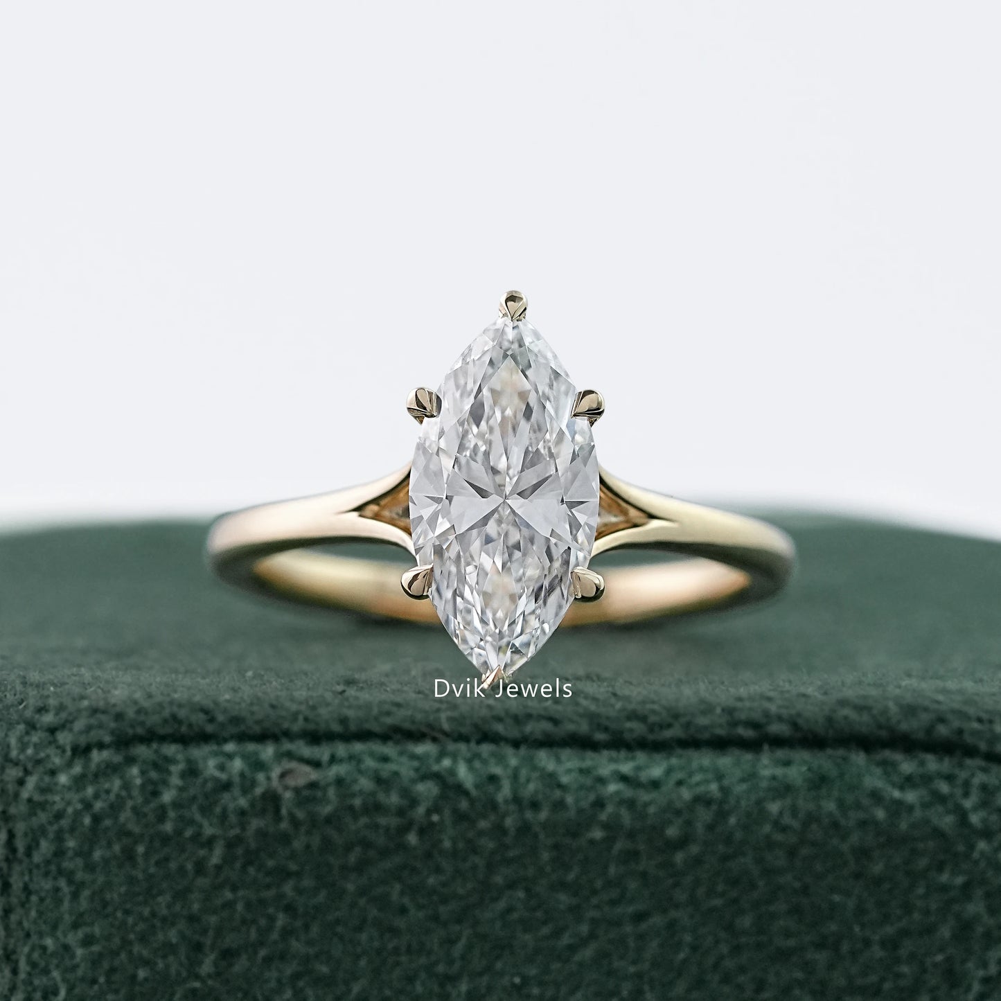 Sleek marquise cut lab diamond solitaire ring in jewelry box by Dvik Jewels