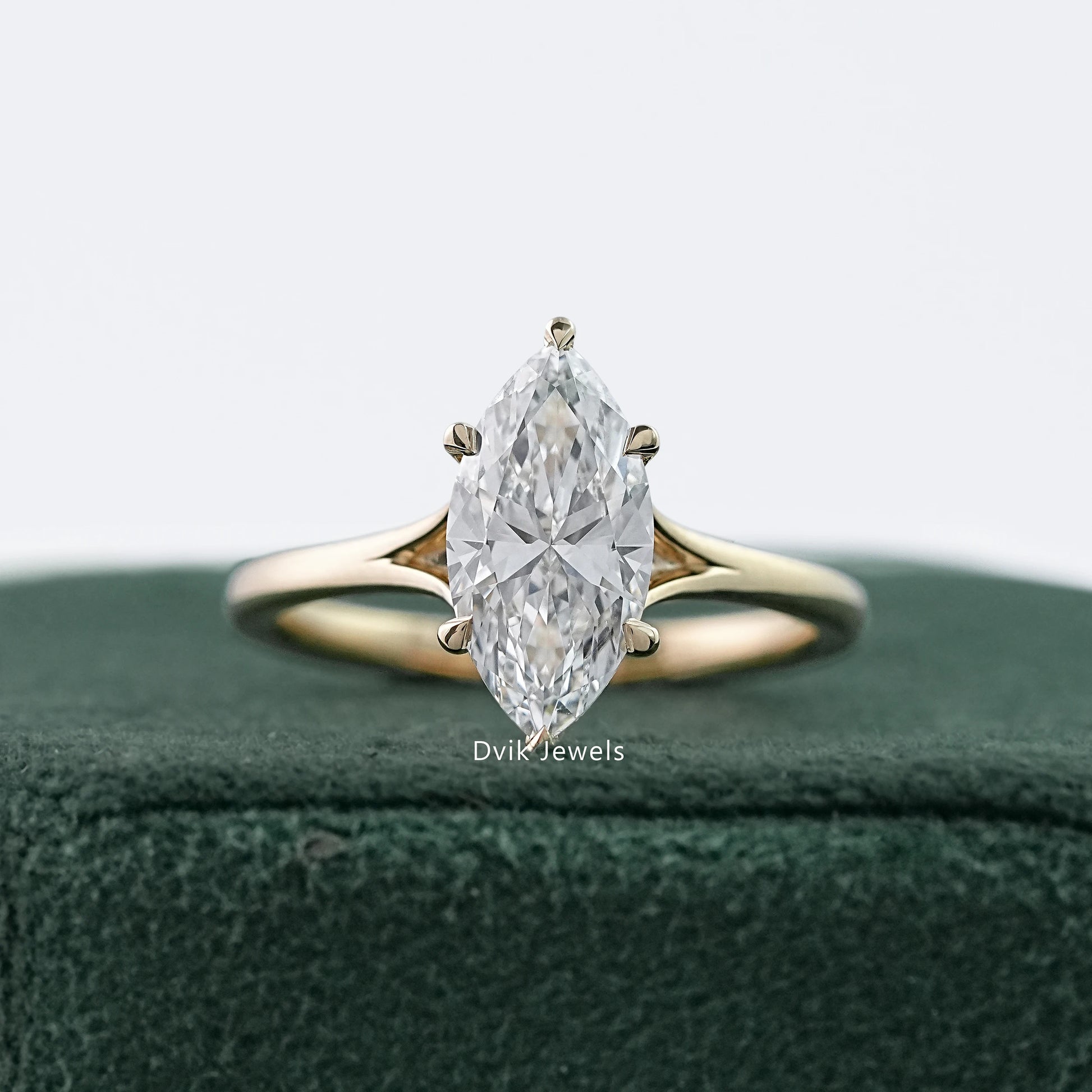 Sleek marquise cut lab diamond solitaire ring in jewelry box by Dvik Jewels