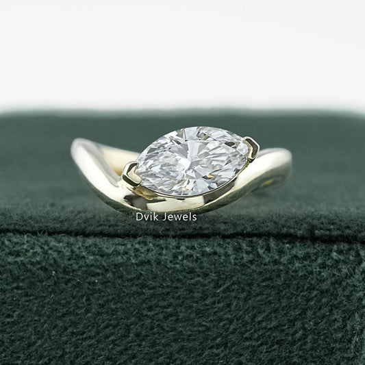 Curved Marquise Cut Lab Diamond Solitaire Engagement Ring featuring sleek gold band by Dvik Jewels