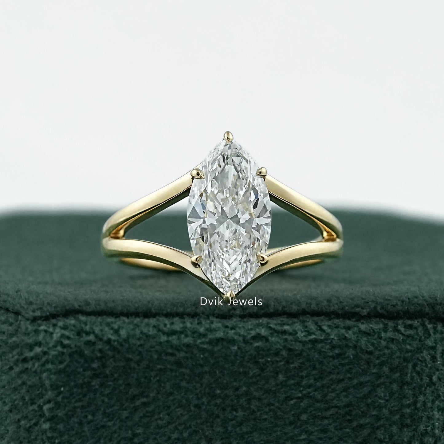 Split shank engagement ring marquise held to show the unique double band