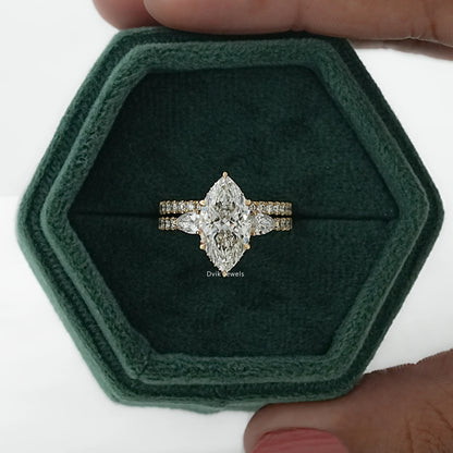 Two-piece bridal ring set with a center marquise diamond in box for front view