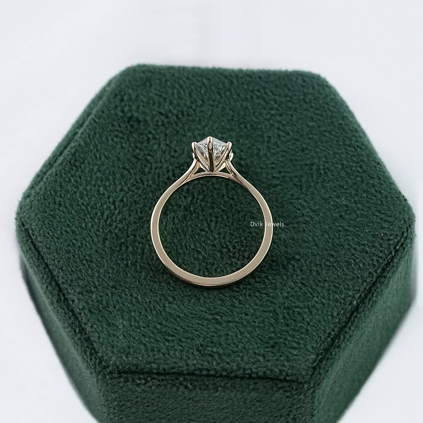 Side view of lab grown diamond solitaire ring showing the high-polished prong setting