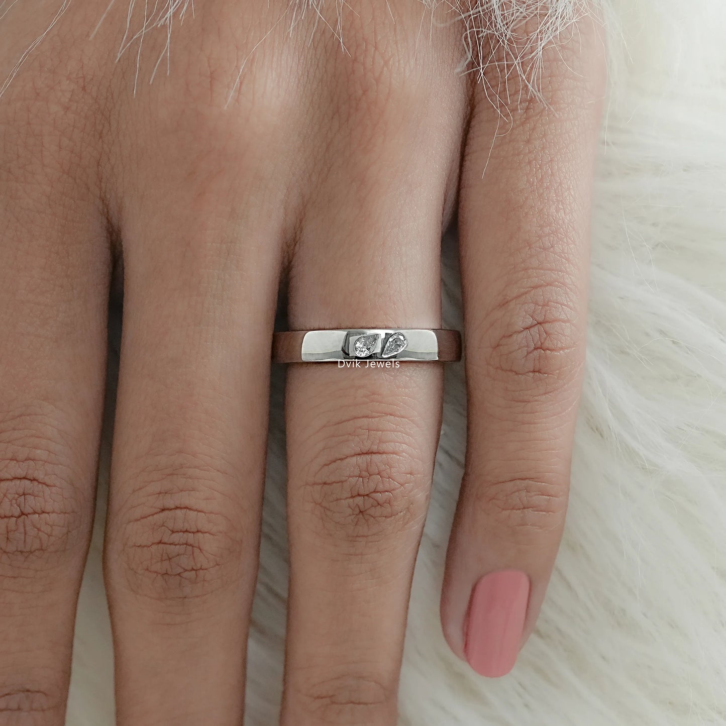 Twin pear diamond sleek band worn by women