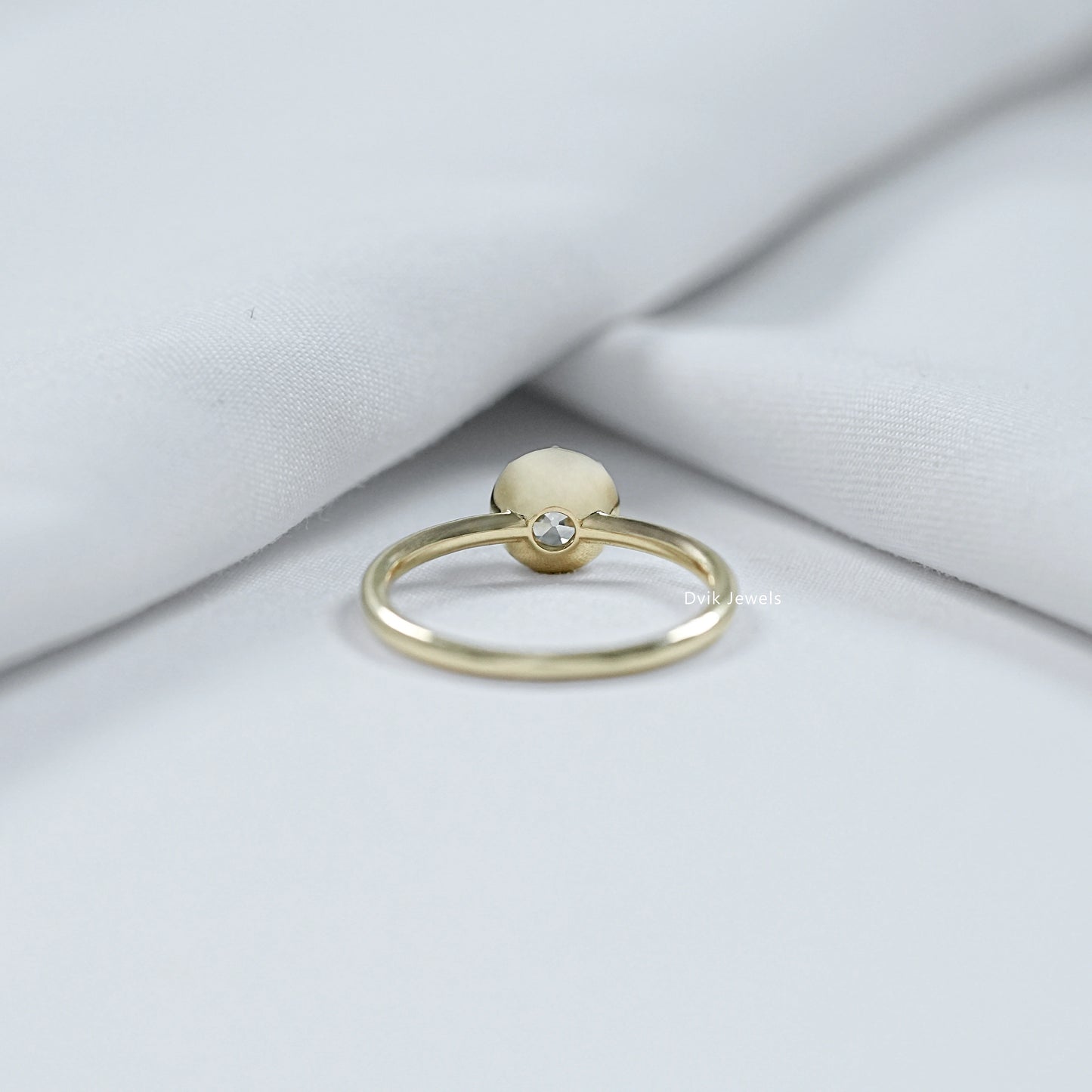 Old mine cut diamond bezel setting showcasing a unique antique design.