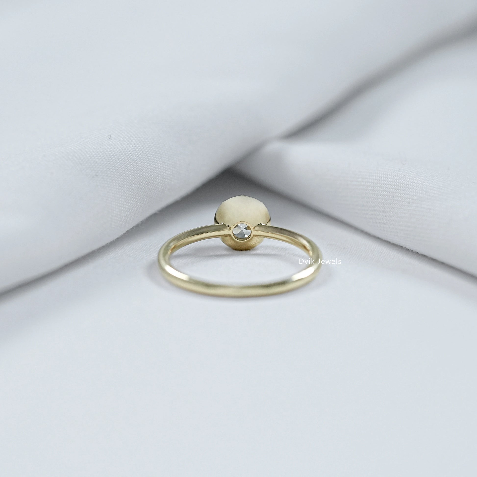 Old mine cut diamond bezel setting showcasing a unique antique design.