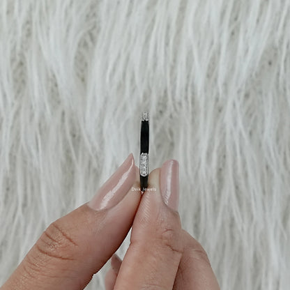 Black enamel wedding band white gold diamond bar held in hand