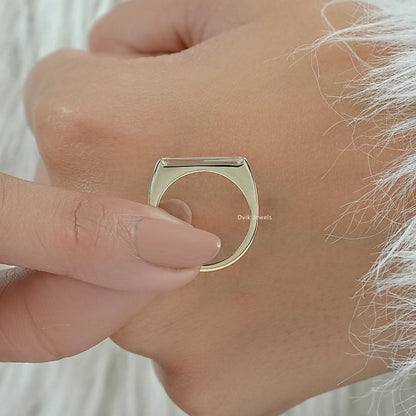 Engagement ring with baguettes highlighting the unique side profile
