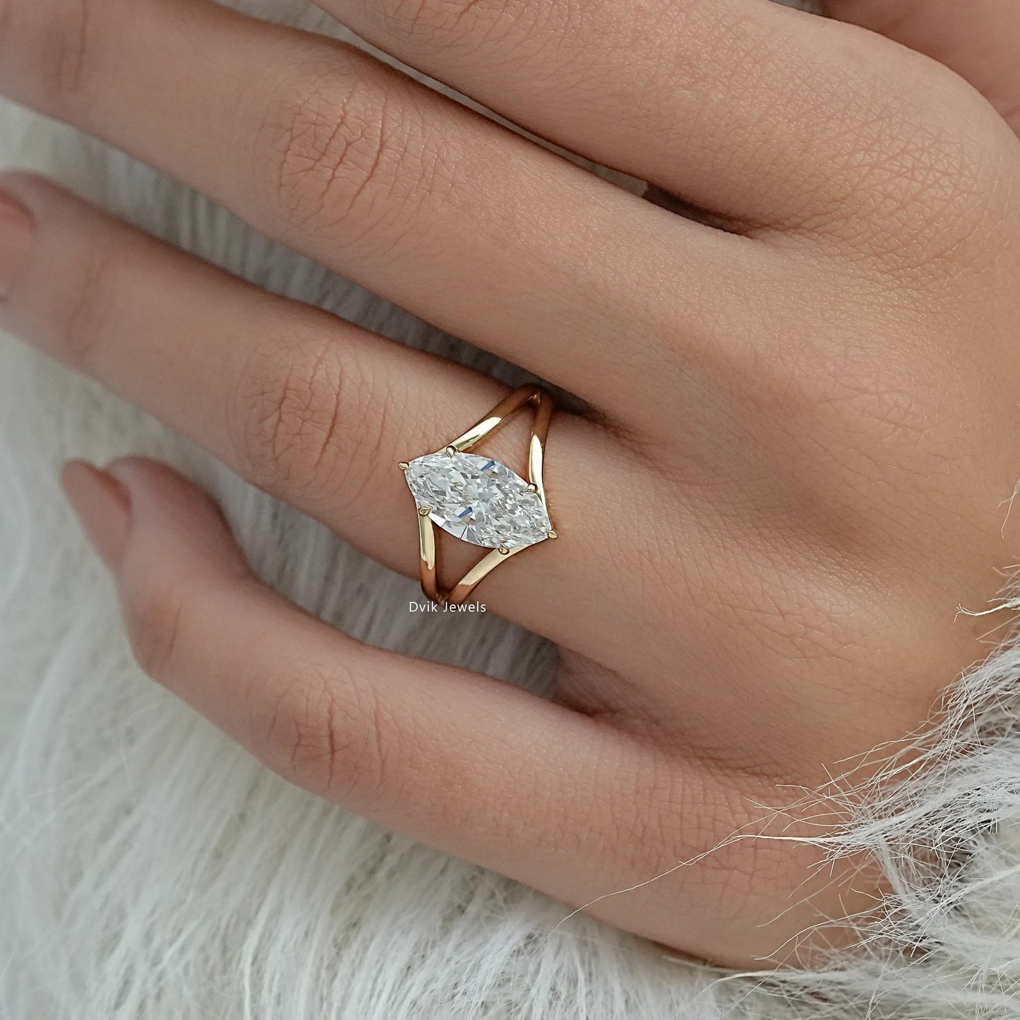 3 carat marquise diamond ring lab grown held between fingers for scale