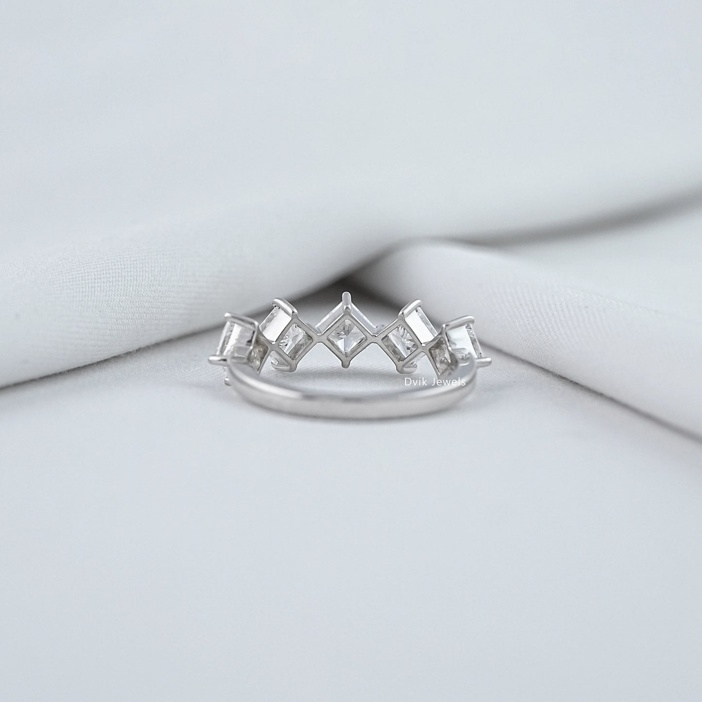 Back view of a kite set princess cut engagement ring showing the open-back gallery setting.