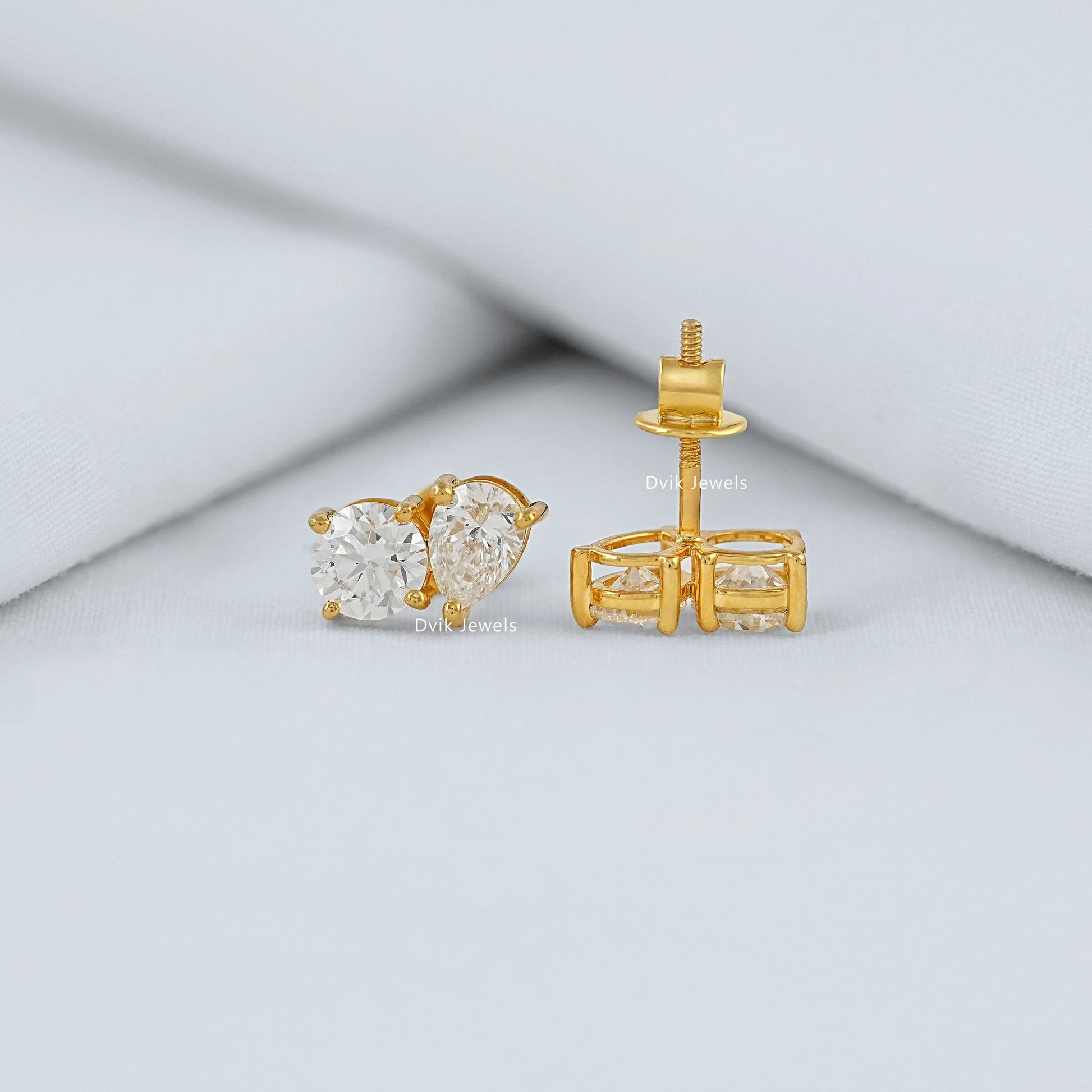 Pear and Round Lab Diamond Toi et Moi Stud Earrings Earrings