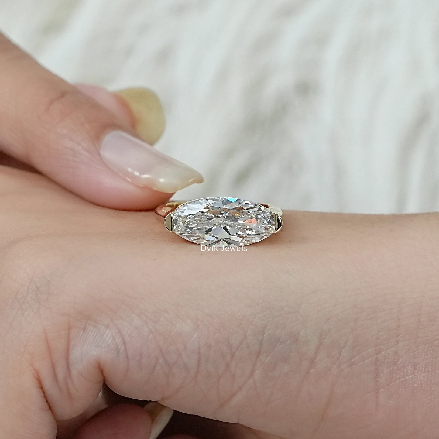 East-West Moval Cut Diamond Solitaire Ring