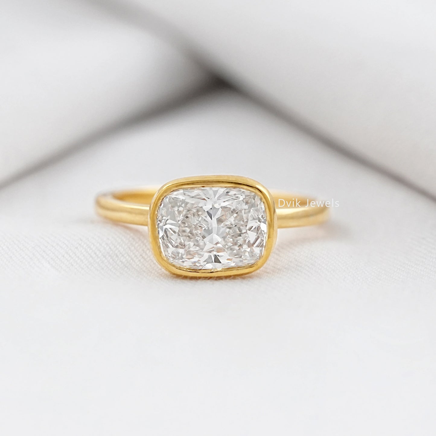 Cushion Cut East-West Bezel Solitaire Engagement Ring