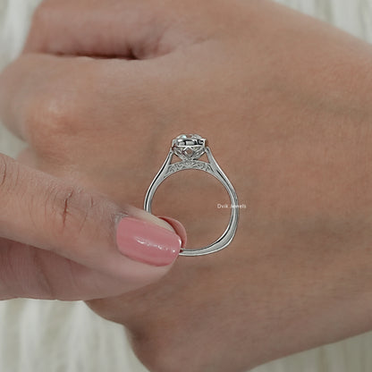 Detailed view of under-gallery and scrolled engraving on an old mine cushion cut bezel diamond ring