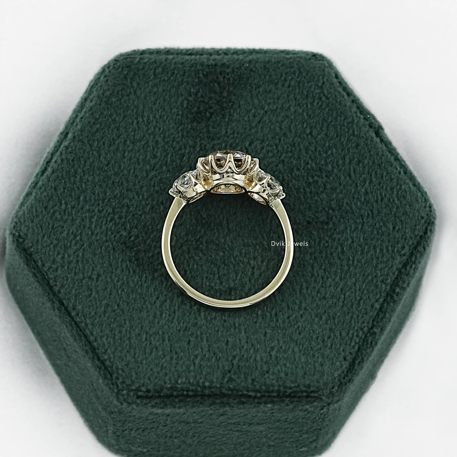 Elongated cushion cut with side stones shown in a detailed close-up view.