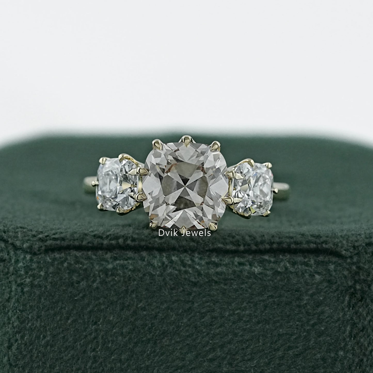 Old mine diamond engagement ring in a vintage 14k gold claw setting.