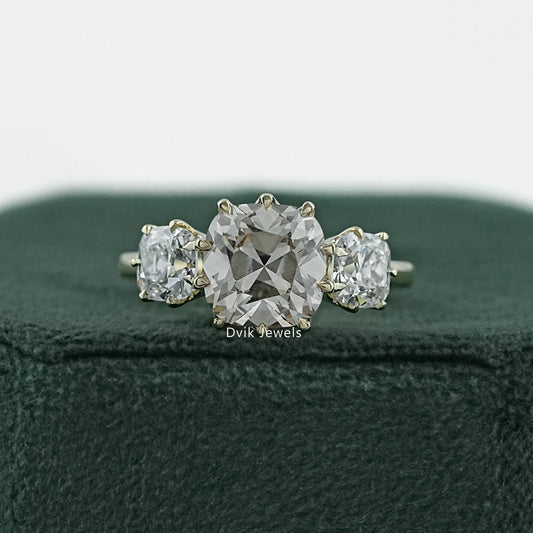 Old mine diamond engagement ring in a vintage 14k gold claw setting.