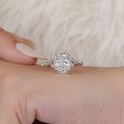 Oval Cut Accent Diamond Twisted Halo Ring