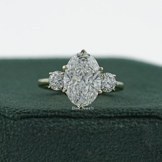 Oval and round engagement rings in a high quality 14k white gold setting