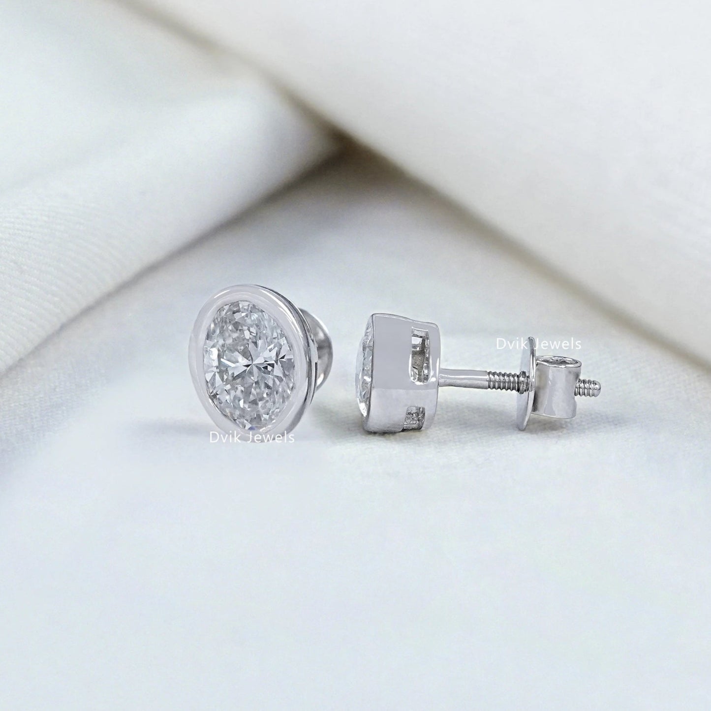 Oval Cut Lab Diamond Bezel Set Stud Earrings