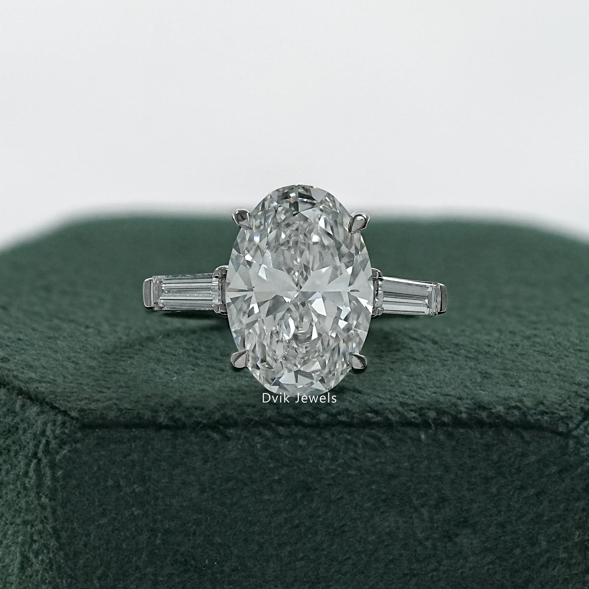 Oval ring with baguette side stones three stone anniversary rings front view