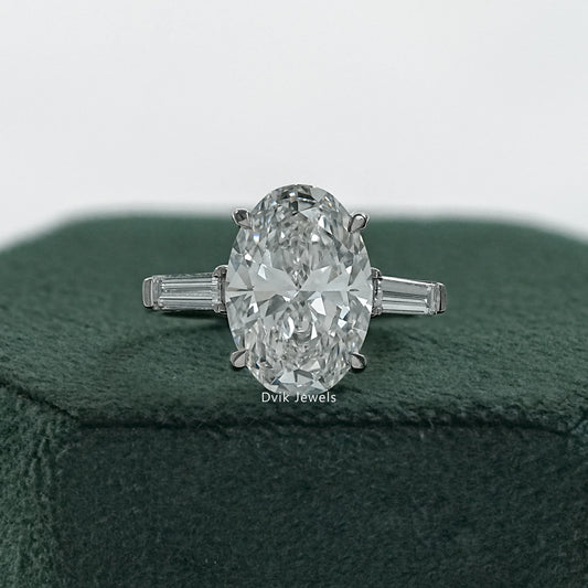 Oval ring with baguette side stones three stone anniversary rings front view