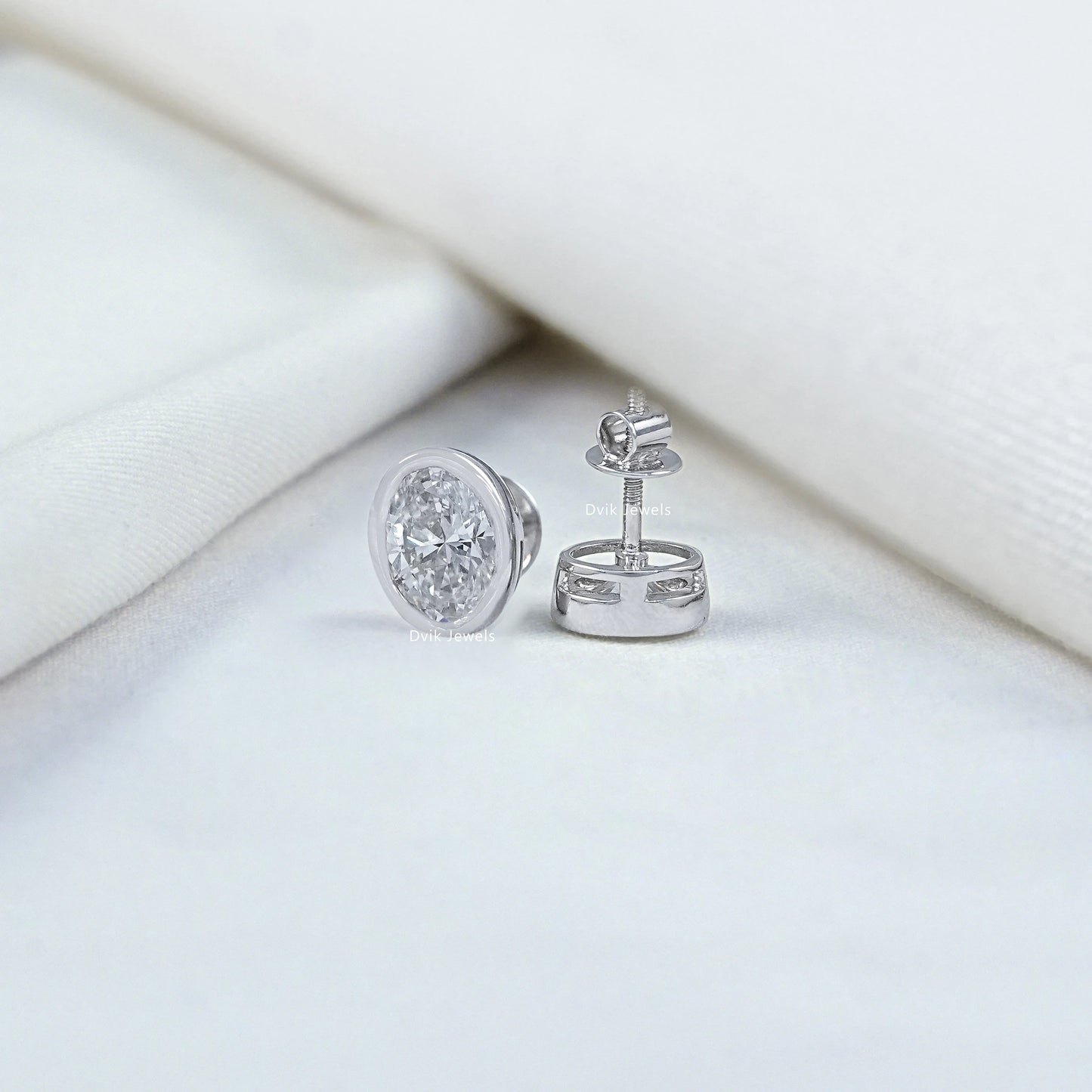 Oval Cut Lab Diamond Bezel Set Stud Earrings