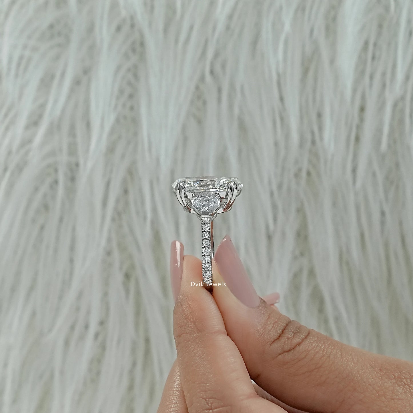 Oval engagement ring with small side stones double prong oval ring close up