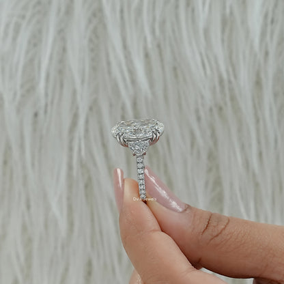 Lab created oval diamond ring half moon side stones profile view