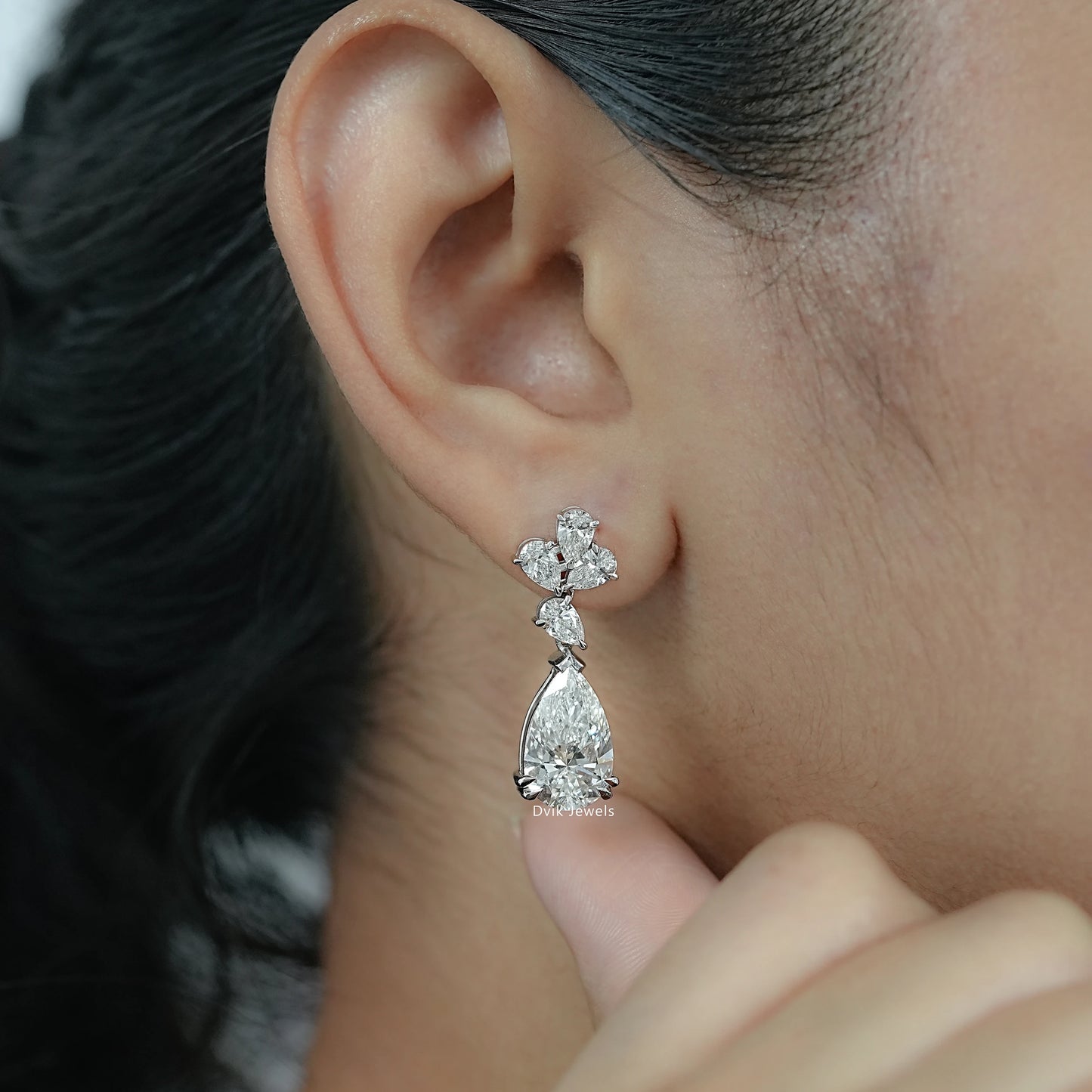 Lab Diamond Pear Cut Floral Drop Earrings showcased on model highlighting modern grace