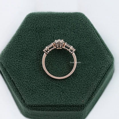 Pear diamond engagement ring with 5-stone diamond displayed on box