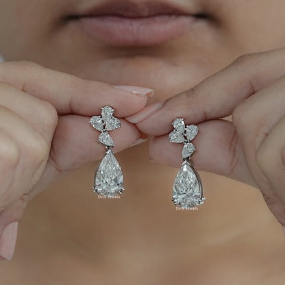 Pear Cut Lab Grown Diamond Floral Drop Earrings displayed by woman showing radiant brilliance