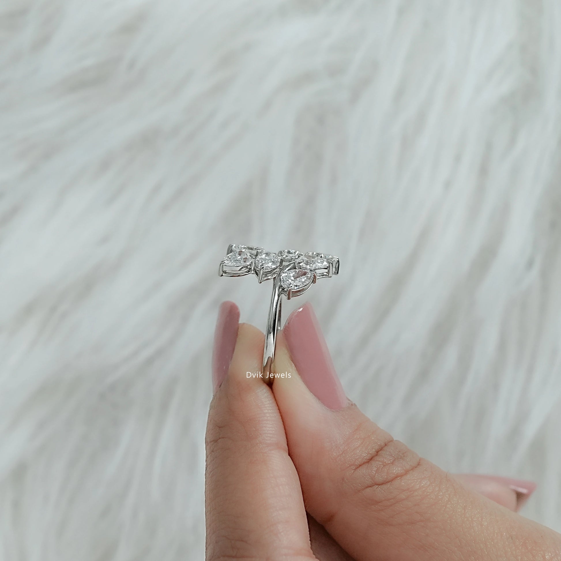 Side view of lab grown diamond cluster ring showing thickness of silver band