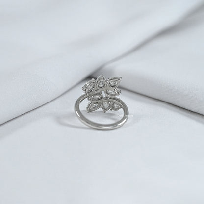 Back view of pear diamond cluster ring showing polished silver band and secure basket setting