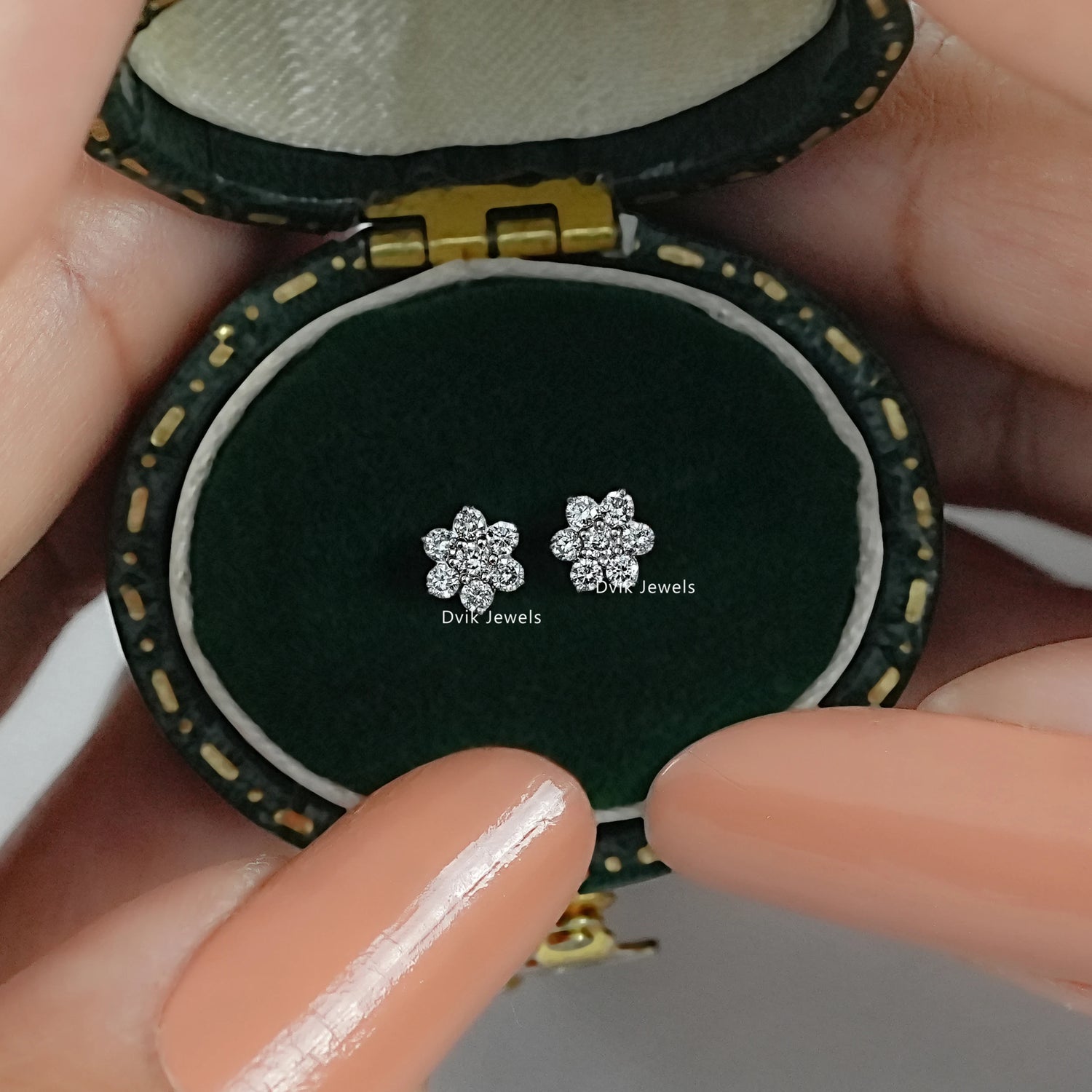 flower cluster earrings by Dvik Jewels in a green velvet box angle view