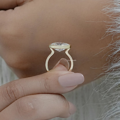 Lab diamond bezel ring yellow gold oval cut solitaire on finger view