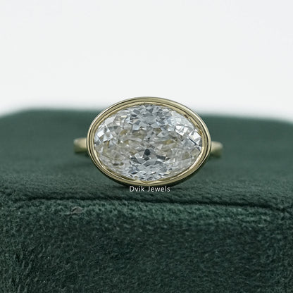 Bezel set oval engagement ring yellow gold solitaire front view