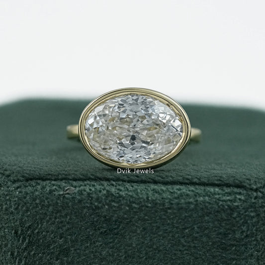 Bezel set oval engagement ring yellow gold solitaire front view