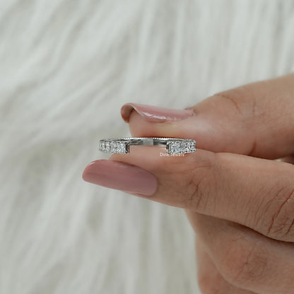 Women hold square princess cut lab diamonds with open-ended band showing bypass-inspired design