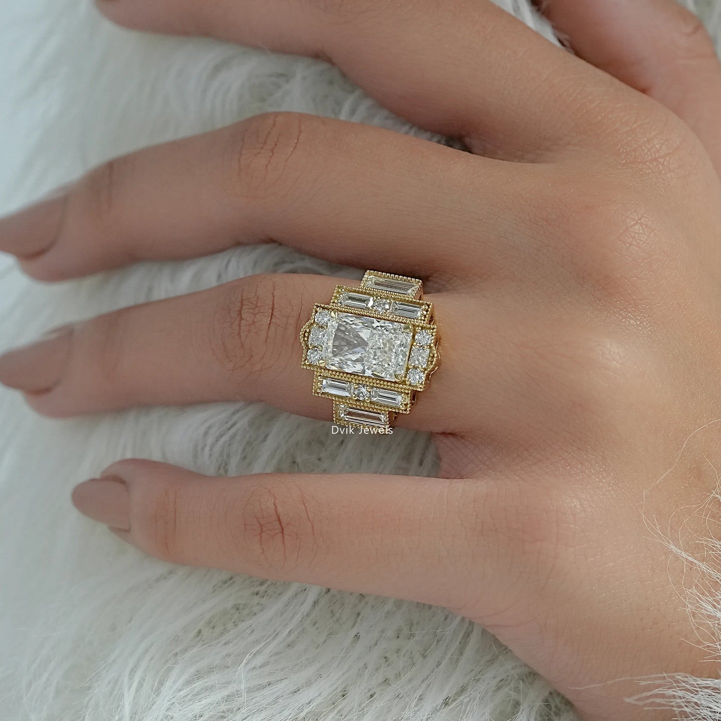 Round diamond with baguettes yellow gold held to show the side profile.