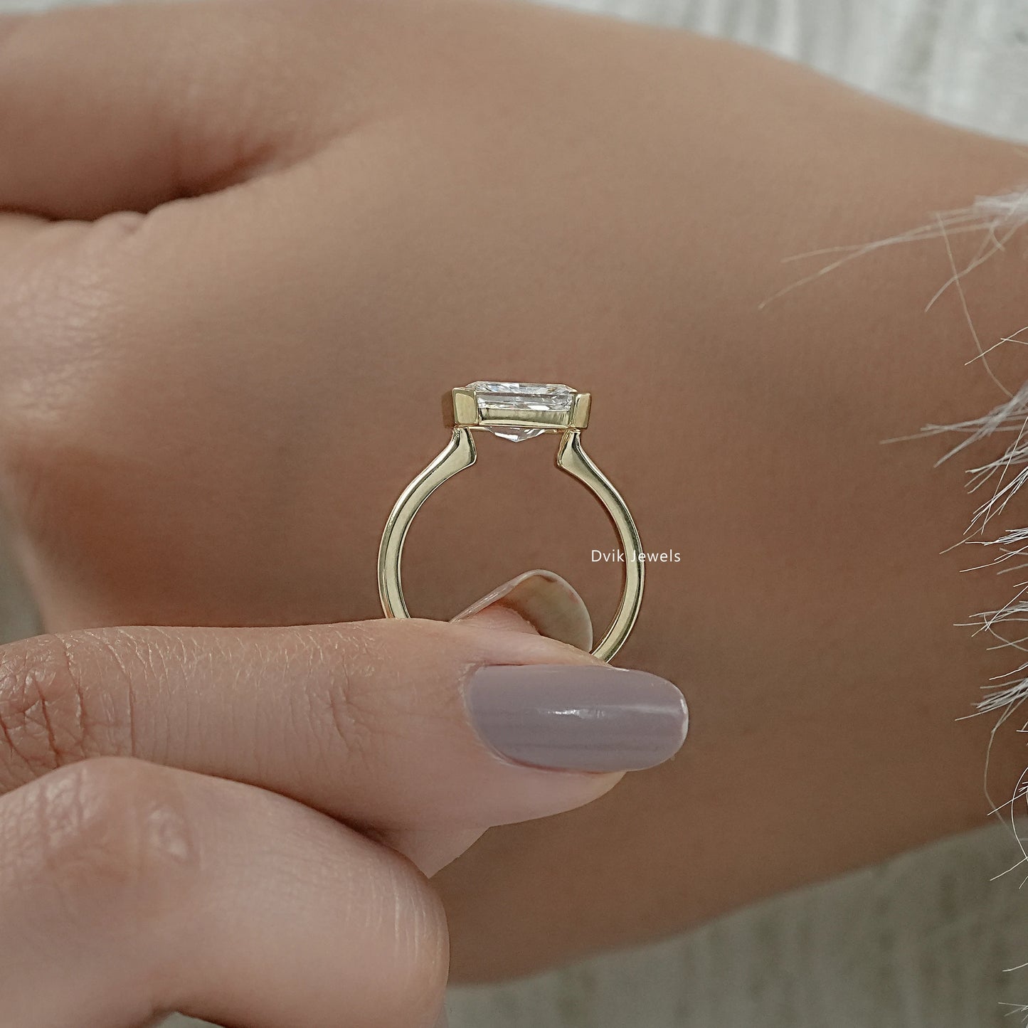 Radiant cut bezel set engagement ring yellow gold side view profile