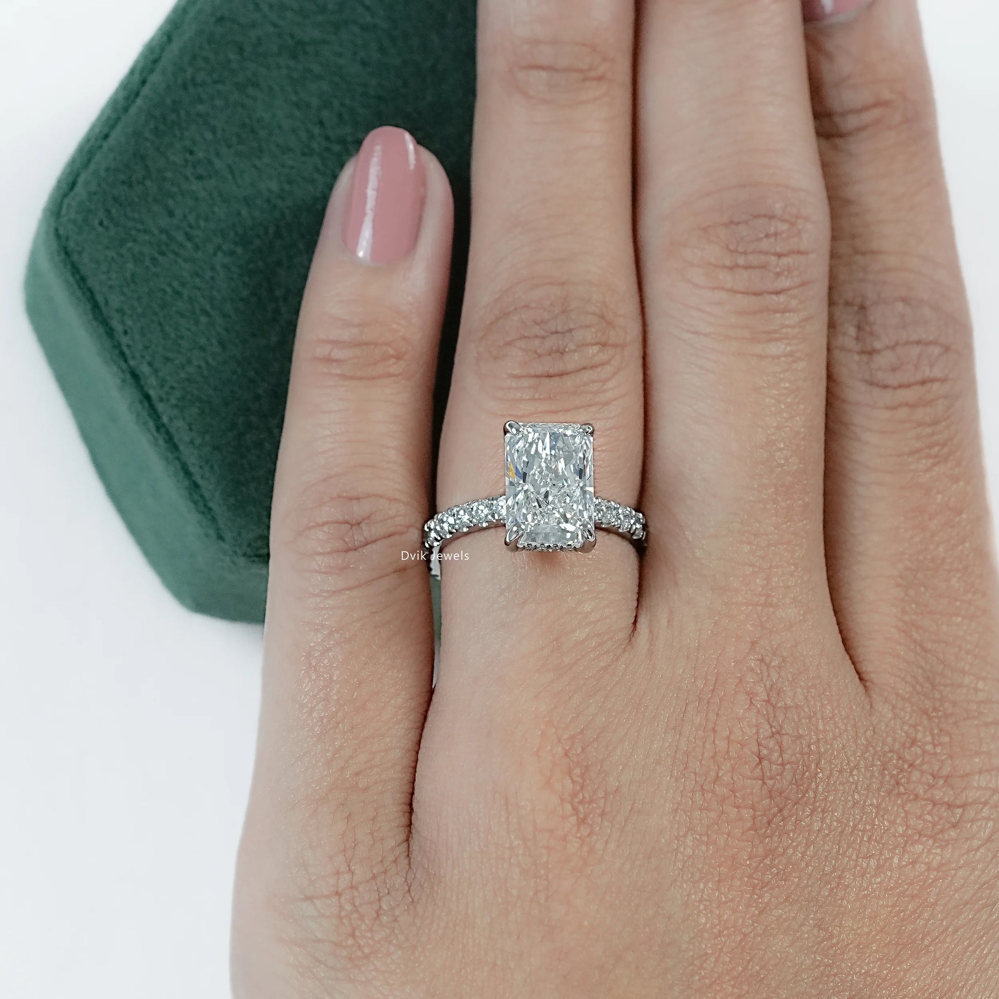 IGI certified Lab Made Diamond Radiant Cut Ring with Round Cut pave band worn on finger